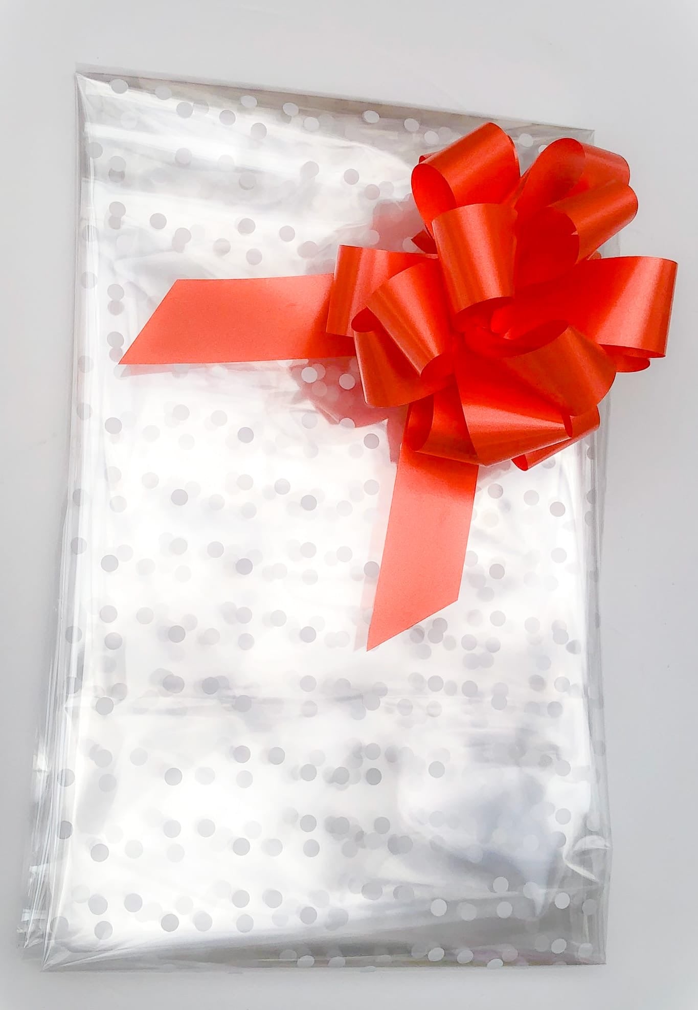 White Dot Cellophane & Orange Pull Bow