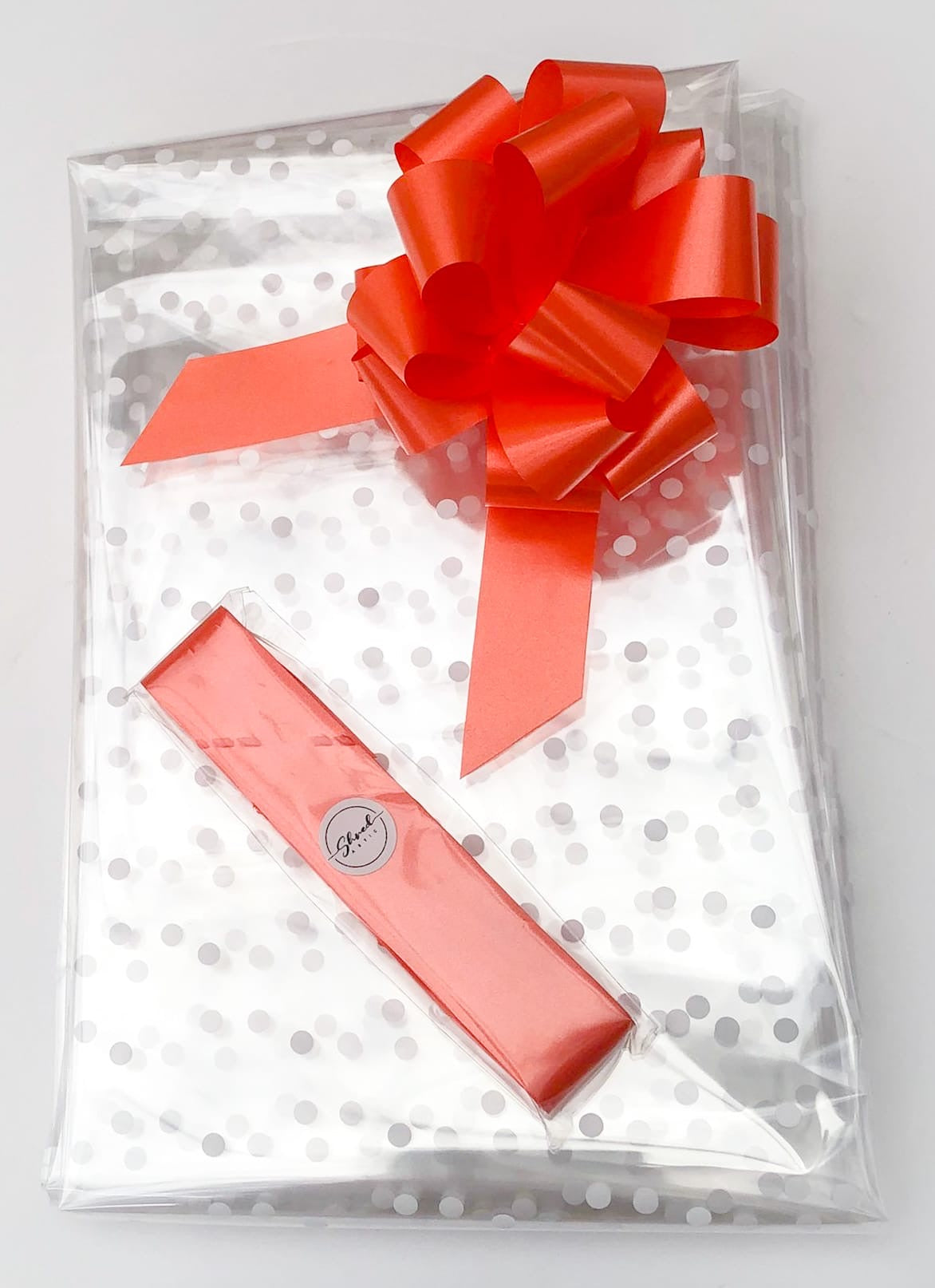 White Dot Cellophane & Orange Pull Bow