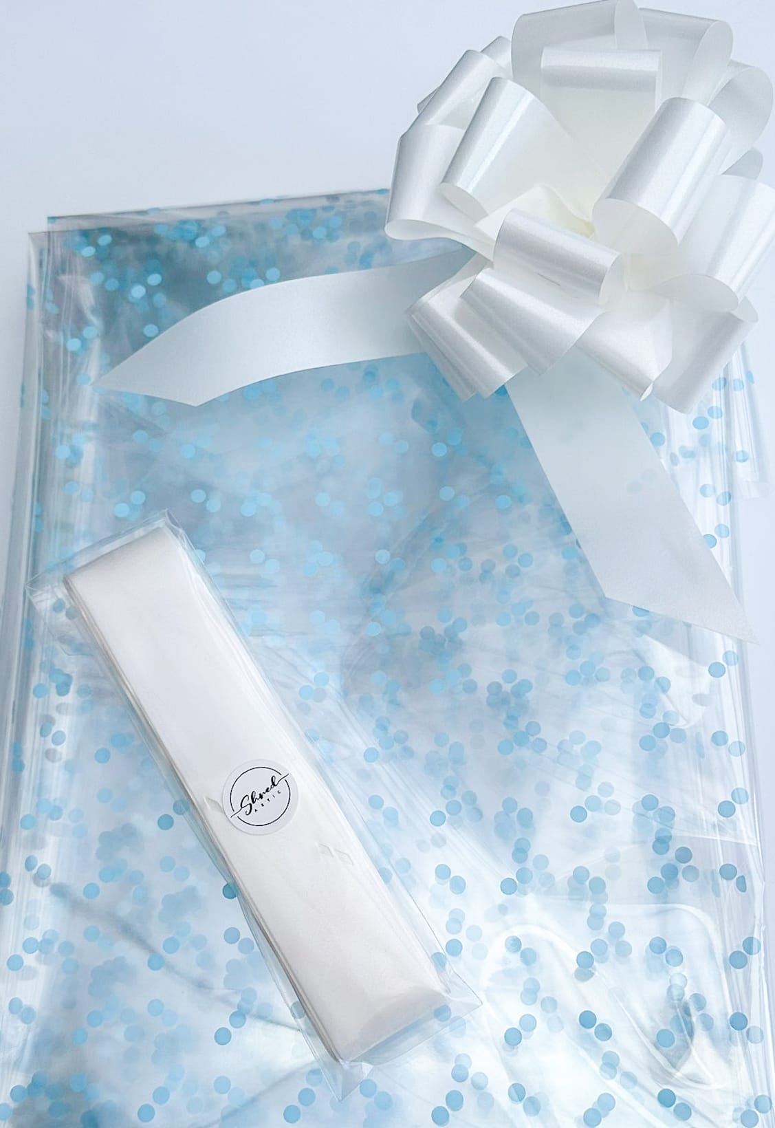 Blue Dot Cellophane & White Pull Bow